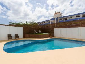 a swimming pool on top of a building at Florida Home Private pool and Jacuzzi in San Bartolomé +24 photos