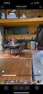 a view of a kitchen and a table in a room at La Cabaña 16 Mazamitla in Mazamitla