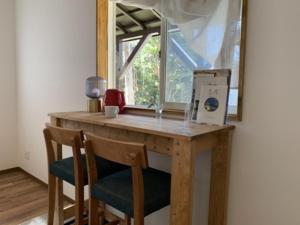 a wooden table with two chairs and a window at Current Shima - Vacation STAY 72696v in Kō