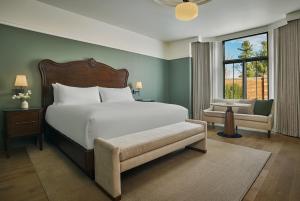 a bedroom with a bed and a chair and a window at Pendry Natirar in Peapack +97 photos