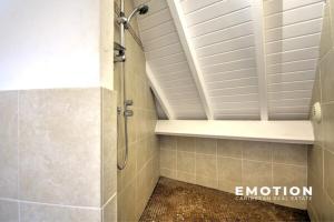 a shower stall in a bathroom with a ceiling at Deux pièces sur la belle plage de Grand Case in Grand Case +15 photos