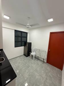 a living room with a bench and a refrigerator at apartment in hulhumale' in Hulhumale