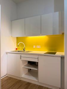 Kuchyň nebo kuchyňský kout v ubytování Stylisches City-Apartment mit Terrasse & Top-Lage - CIVITA Apartments