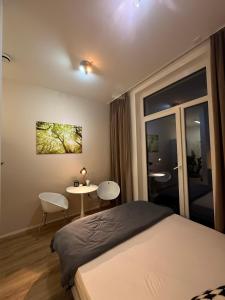 Postel nebo postele na pokoji v ubytování Stylisches City-Apartment mit Terrasse & Top-Lage - CIVITA Apartments