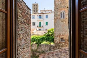 a view out of a window of buildings at Corso Italia - 2 min da Piazza Grande in Arezzo