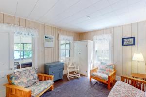 a living room with a couch and a chair at Garden Island's Birch in Charlotte