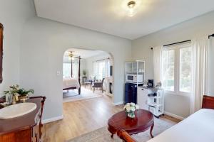 a kitchen and living room with a sink and a table at Santa Rosa in Santa Barbara