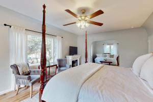 a bedroom with a bed and a ceiling fan at Santa Rosa in Santa Barbara +15 photos