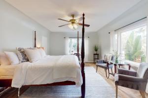 a bedroom with a bed and a ceiling fan at Santa Rosa in Santa Barbara