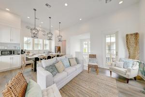 a living room with a couch and a kitchen at Vida del Mar in Mustang Beach
