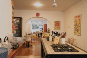 a kitchen with a stove and a counter top at Vecinos by La Palmera in Bogotá