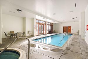 a large indoor pool with a hot tub in a building at Oro Grande 216 in Keystone
