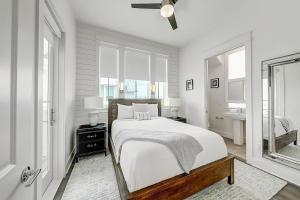 a white bedroom with a bed and a window at At Ease - Palmilla Beach 214-1 in Mustang Beach +34 photos
