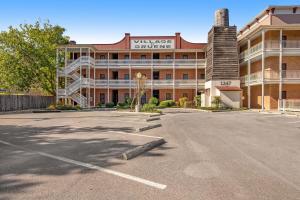 an empty parking lot in front of a building at The Village at Gruene - Unit 203 in Gruene