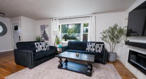 a living room with a couch and a coffee table at Entire home, 6 min drive to UIUC in Champaign