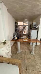 a kitchen with a table in the middle of a room at alaguthe in Olavarría