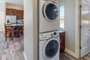 a kitchen with a washer and dryer in a house at Rim View 7 in Spanish Valley