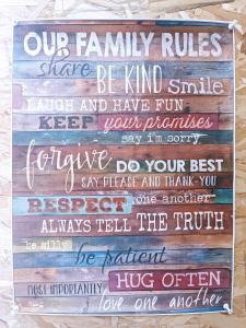a sign that says our family rules share be kind and have fun keep your promises at Tevosyan Gold EVN Airport in Pʼarakʼar