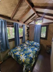 Ένα ή περισσότερα κρεβάτια σε δωμάτιο στο Gecko Hideaway Jungle Getaway