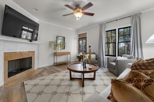 a living room with a couch and a fireplace at Iris Manor Luxury Modern Stay Near UAB in Birmingham