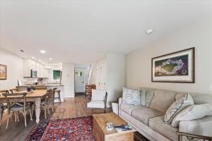 a living room with a couch and a table at Lodge Condo 35 in Stowe Fork