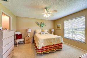 a bedroom with a bed and a ceiling fan at Snowbirds Welcome! Naples Resort Condo Near Golf in Naples +19 photos