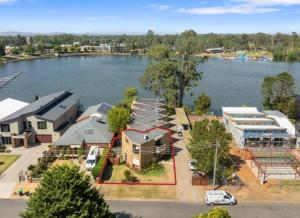 an aerial view of a house next to a lake at Young unit1 Water Views in Nagambie