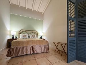 a bedroom with a bed with two pillows on it at Coronado Luxury Club and Suites,Oasis in El Quije +24 photos