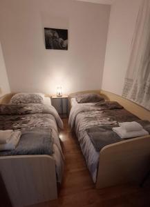 Postel nebo postele na pokoji v ubytování Macy 25