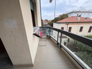 a balcony with a towel rack on the side of a building at Bartoli 8, Viserbella di Rimini in Rimini