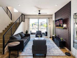 a living room with a couch and a table at Chaparral - 2 Units - Jacuzzi - Heart of Old Town in Scottsdale