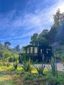 an old house sitting on the side of a road at Reserva los Bollenes in Constitución