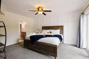 a bedroom with a bed and a ceiling fan at Pebble Retreat-Private Pool-7 Mins Arizona State in Tempe +68 photos