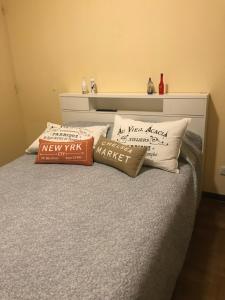 two pillows sitting on top of a bed at Vista al mar in Mar del Plata