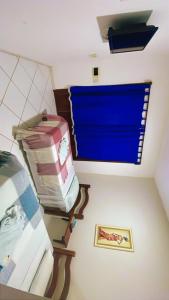 a room with a pile of luggage and a window at Pousada Praia da Pipa in Pipa
