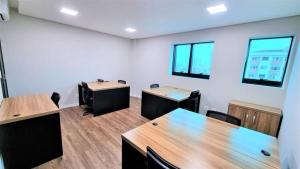 a conference room with tables and chairs and windows at Amazon Park Hotel in Belém +11 photos