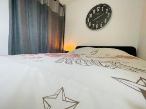 Ένα ή περισσότερα κρεβάτια σε δωμάτιο στο Appartement Confortable