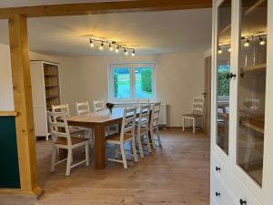 a dining room with a wooden table and chairs at 4-Steine-Blick, Wohnung 1 in Schöna