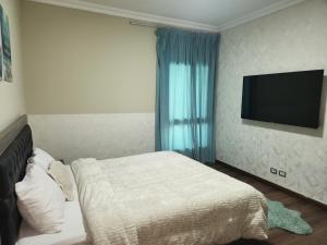 Ένα ή περισσότερα κρεβάτια σε δωμάτιο στο Cozy green stay