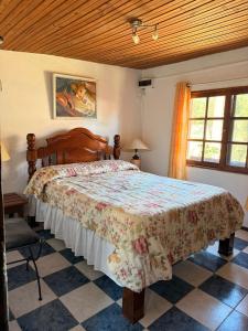a bedroom with a large bed in a room at Casa cómoda en La Barra in Punta del Este