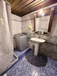a bathroom with a sink and a toilet at Casa cómoda en La Barra in Punta del Este