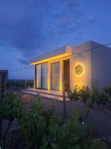 a building with a clock on the side of it at ENTREVID suites & spa in Anchoris +46 photos