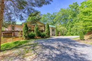 an empty driveway to a house with trees at Memorable "Deer & Doe" by HoneyBearCabins 4BR 3BA, Mountain View Deck, Farmhouse Decor, Fireplace, 3 Acres in Sevierville