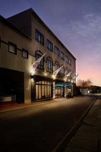 an empty street in front of a building at night at Great Southern Hotel Perth in Perth