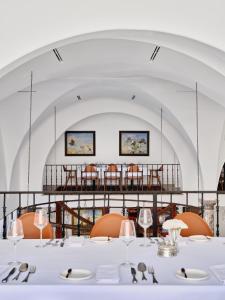 a dining room with a table and chairs at Kainar Hotel in Shymkent