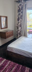 Postel nebo postele na pokoji v ubytování Porto Matrouh