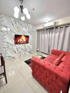 Posezení v ubytování Staycation Near Mall of Asia + 11 fotografií