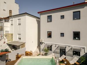 En balkon eller terrasse på DesKanzo Guest House - Silva Brinco