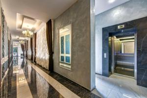 a hallway of a building with a door and windows at Oscar Hotel in Gelendzhik
