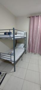 Postel nebo postele na pokoji v ubytování Muscat Galaxy Hostel